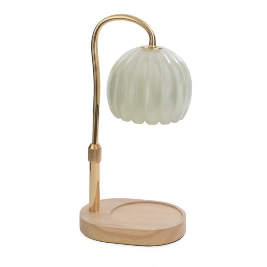 Candle lamp with a milk glass shade and gold metal arm on a white background